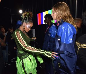 NEW YORK, NY - SEPTEMBER 10: Rihanna prepares models backstage at the FENTY PUMA by Rihanna Spring/Summer 2018 Collection at Park Avenue Armory on September 10, 2017 in New York City. Photo by Bryan Bedder/Getty Images for FENTY PUMA By Rihanna